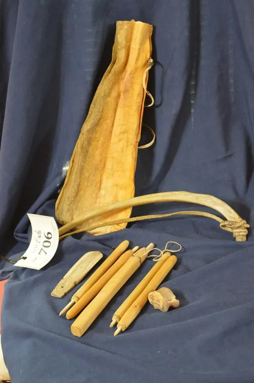 A Jackfish Skin Bag And 8 Wooden Tools That Go Into It.