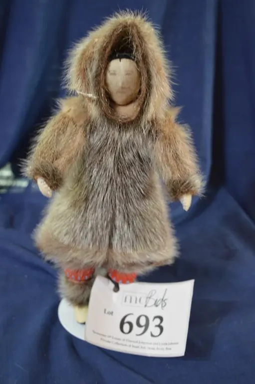 A Woman Doll In Traditional Seal Fur Parka And Boots With Yarn Hair, And Nylon Face. Coat Is Fragile