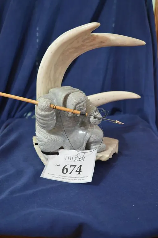 Large Detailed Carving Of An Inuit Hunter Holding A Wooden And Steel Spear With Removable Spear Head