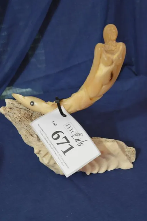 Sedna On A Whale Bone Wave With A Carved Face.
