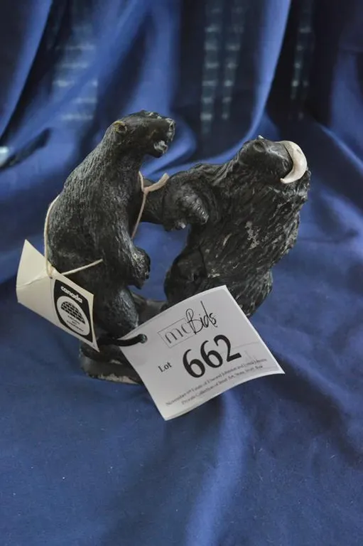 A Polar Bear And A Muskox Fighting. Igloo Tag