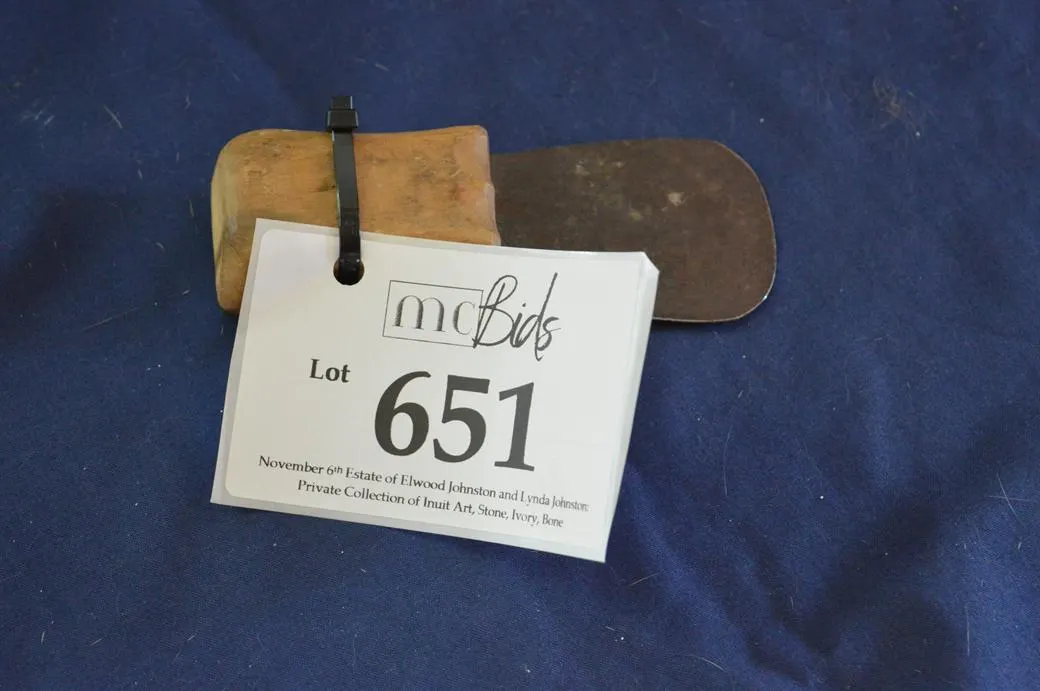 A Scrapping Knife Is Used By Women To Clean A Hide.