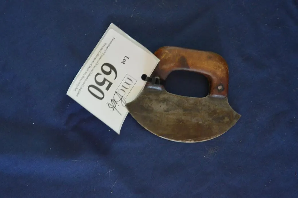 An Ulu Is A Women's Knife Used For Slicing.