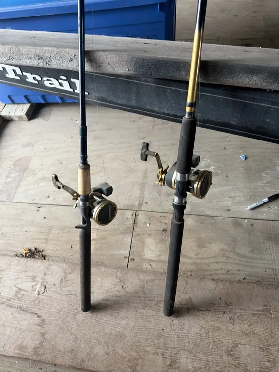 Pair of fishing rods, reels with counters, winner takes both
