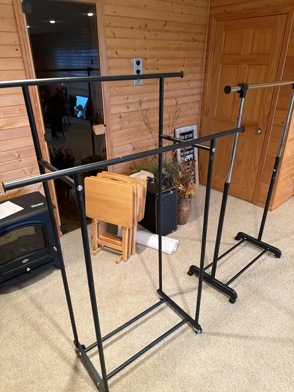 Two clothes racks on wheels