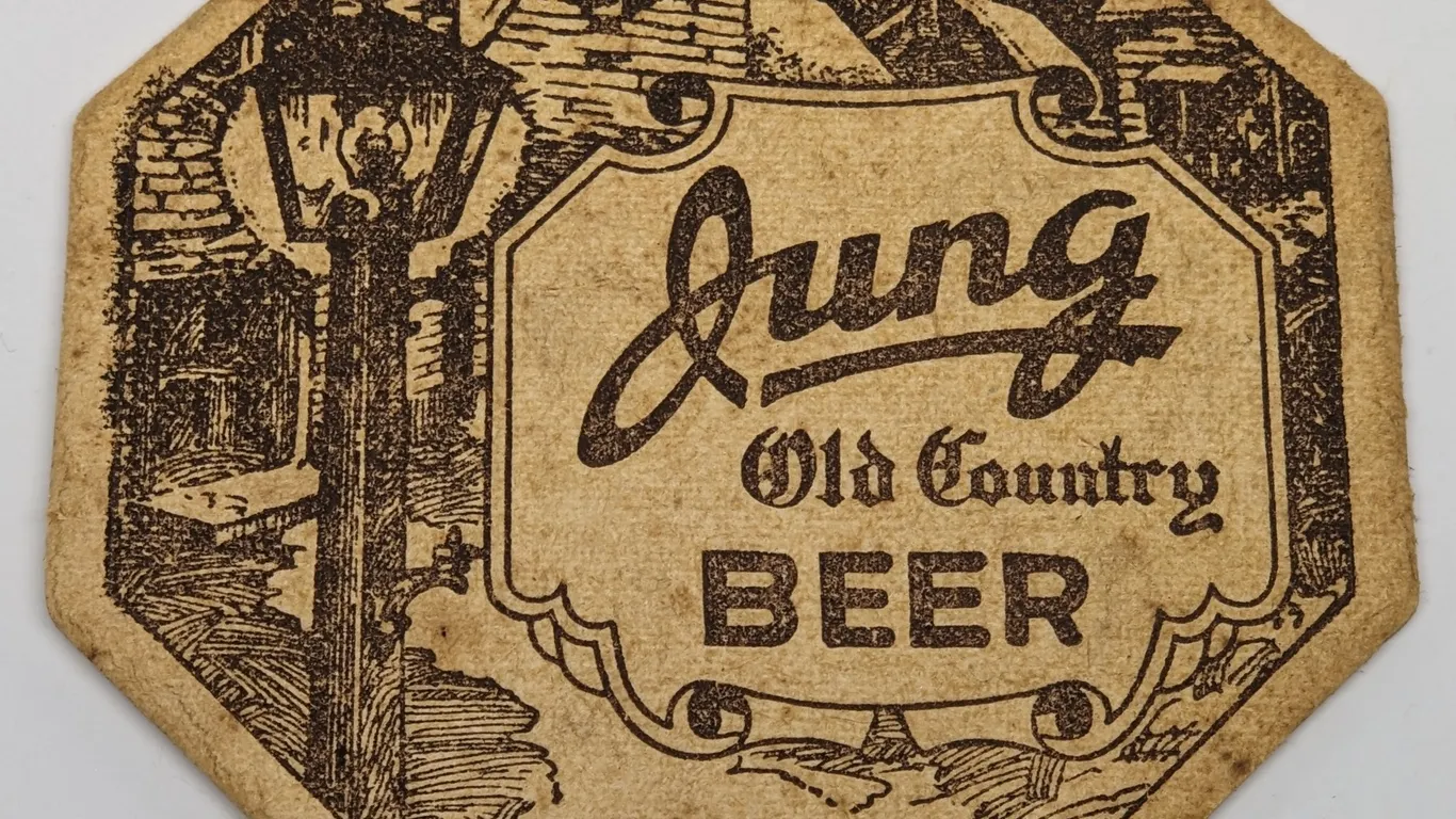JUNG OLD COUNTRY BEER COASTER RANDOM LAKE WISCONSIN