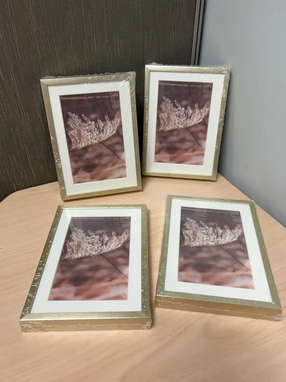 Four Gold-Tone Tabletop Photo Frames with Matting