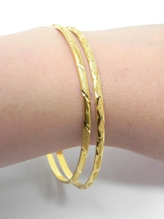 PAIR OF ALTINBAS 22KT GOLD BANGLES 9.42g $4300.00
