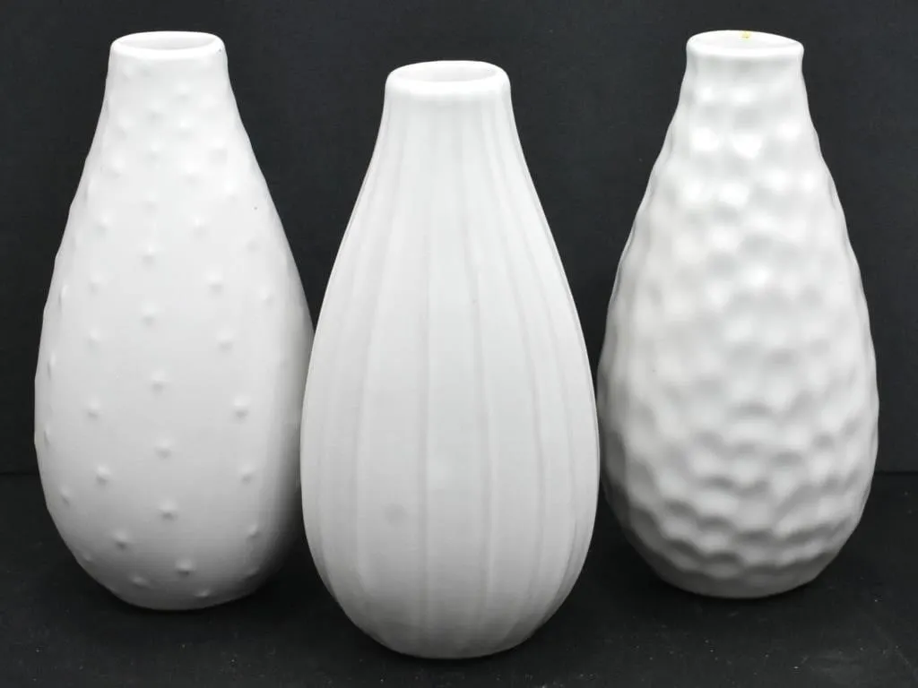 THREE WHITE CERAMIC VASES