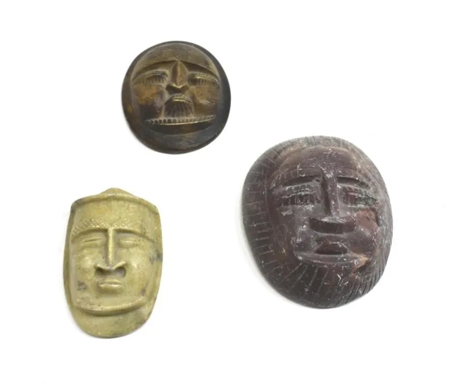TRIO OF DECORATIVE STONE CARVED AFRICAN MASKS