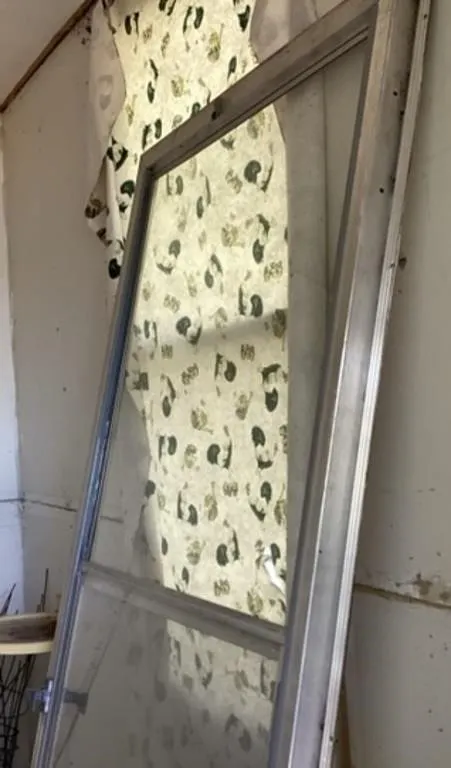 Two aluminum storm doors