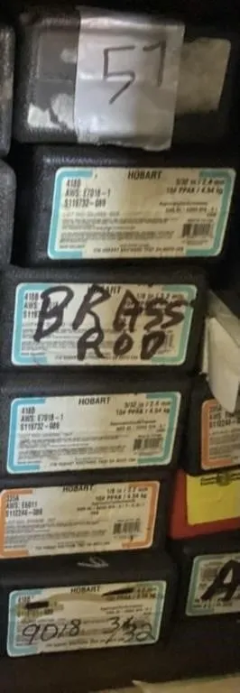 Six unsealed boxes welding rods