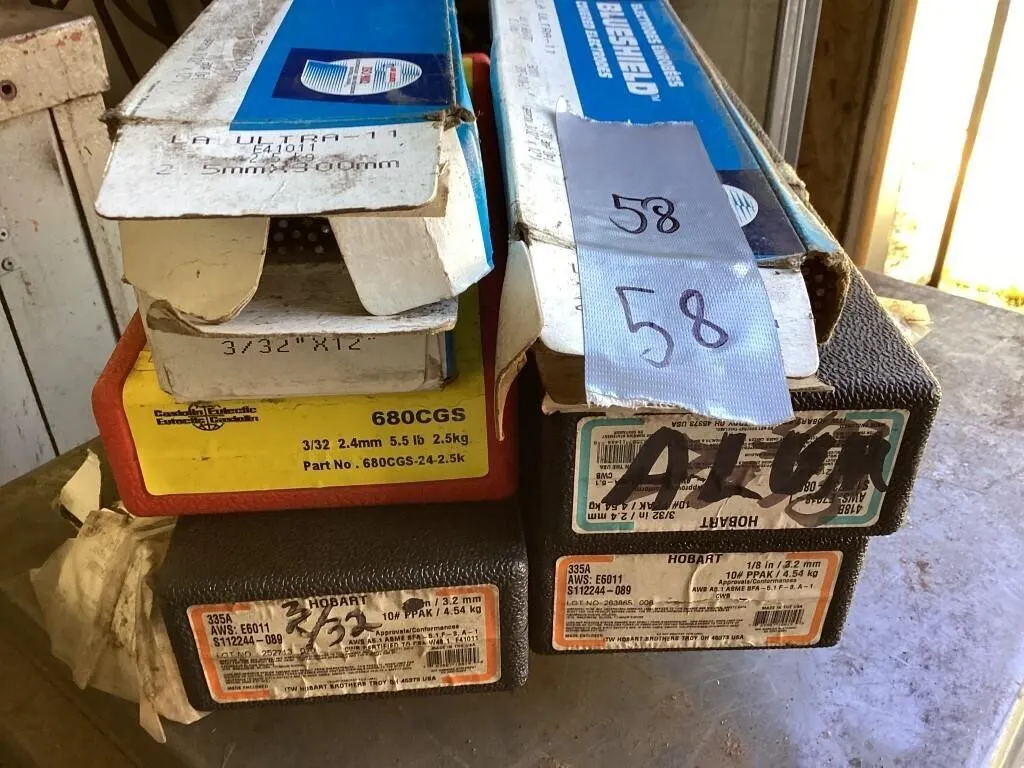 Seven unsealed boxes welding rods