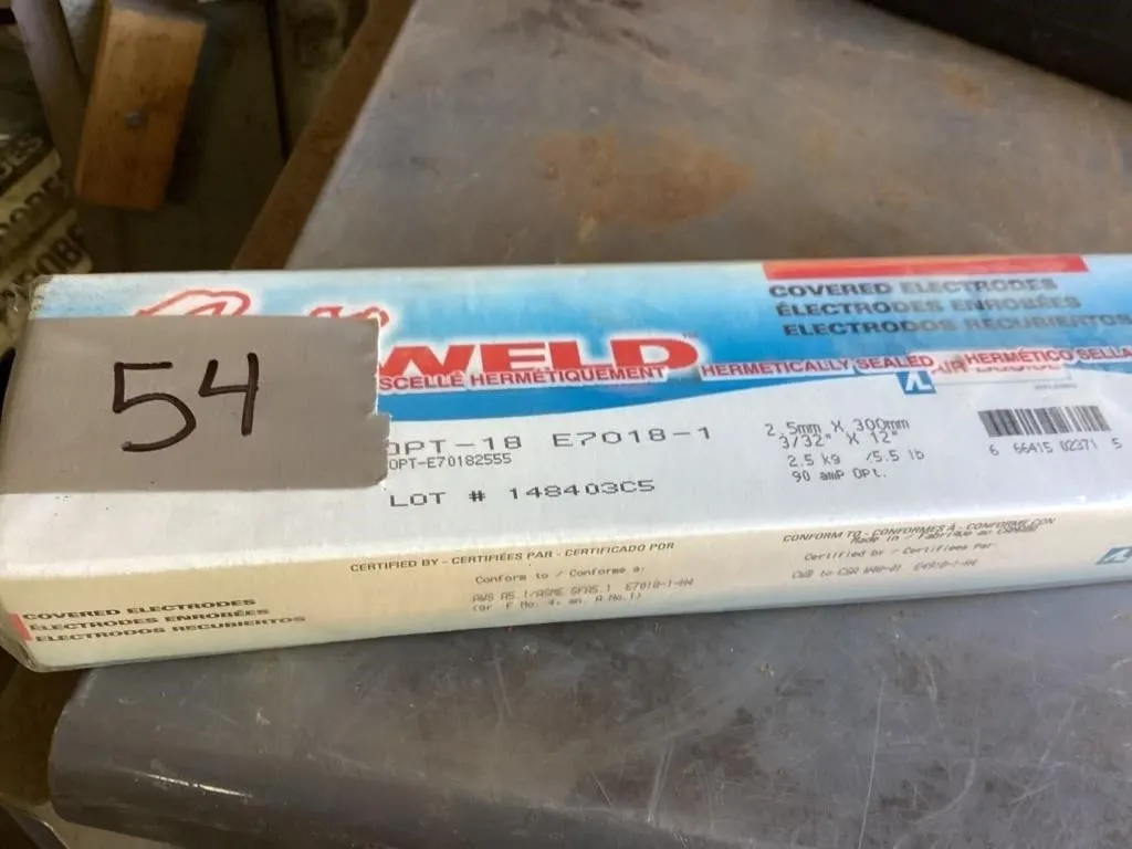 Four sealed boxes 7018 welding rods