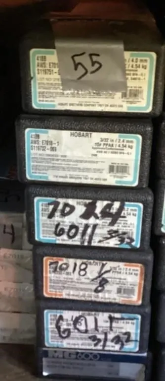 Six unsealed boxes welding rods