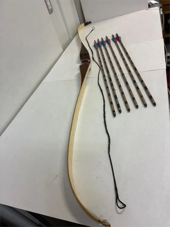 64” bow with 6 arrows.
