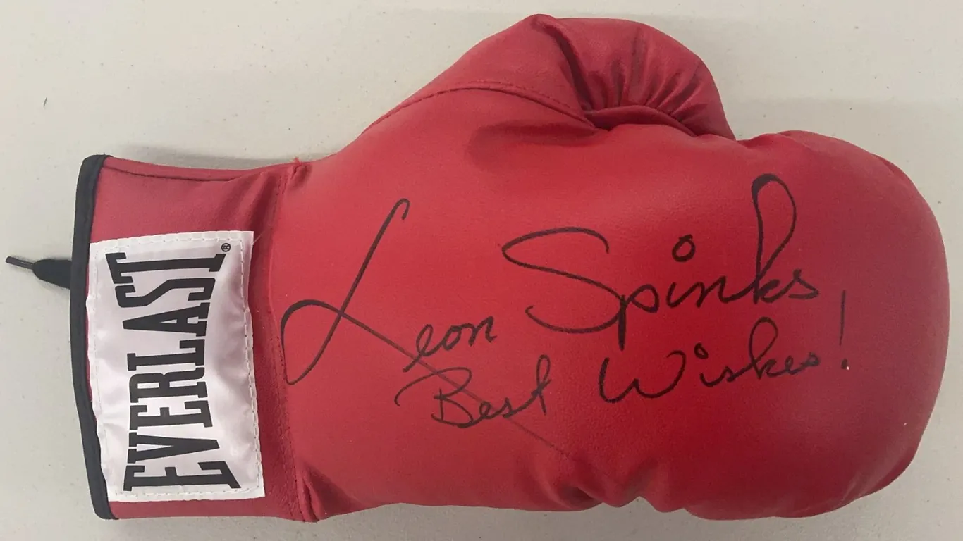 Everlast Boxing Glove Signed "Leon Spinks" - Unauthenticated AND Muhammad Ali "Underwater Training"