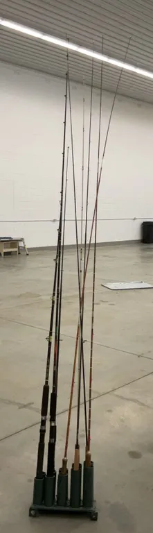 Eight Assorted Fishing Rods in 10-Slot Holder
