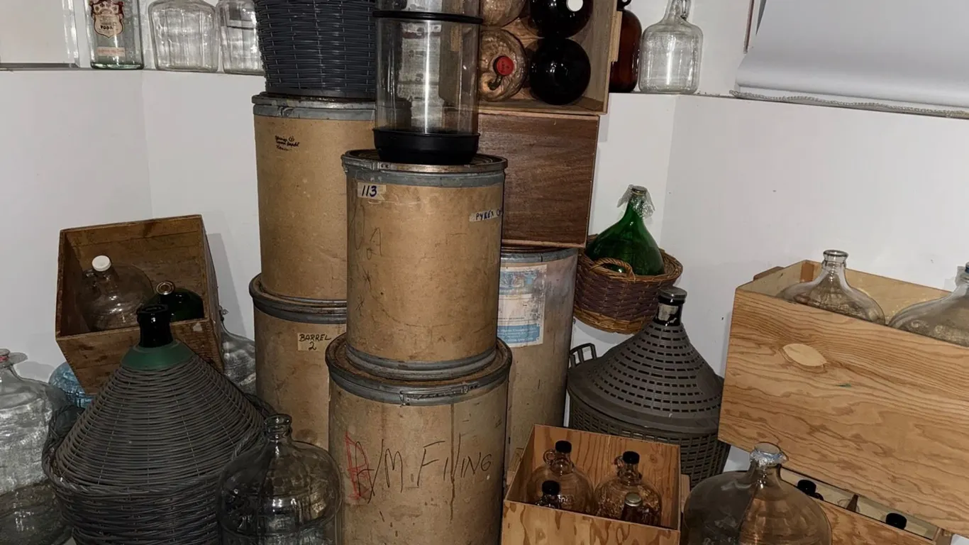 Glass Carboys with Wooden Crates and Wicker-Covered Vessels
