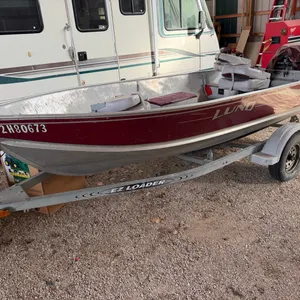 14’ Lund Aluminum Fishing Boat w/ 25hp OB Motor (Carb Job Completed) & EZ Loader Trailer