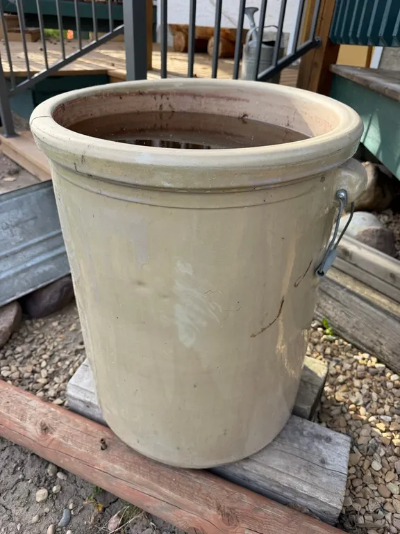 Antique Crocks and Wooden Wagon Wheels