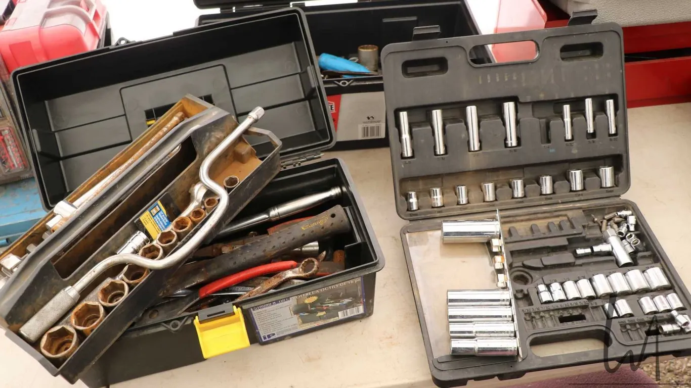 Selection of tools including sockets, speed wrench, pliers etc.