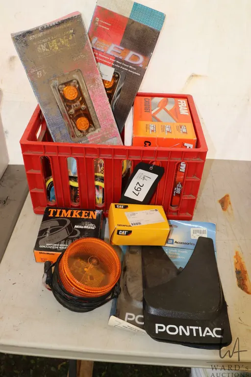 Selection of car and truck parts including Pontiac mud flaps, orange beacon and other lights, new in