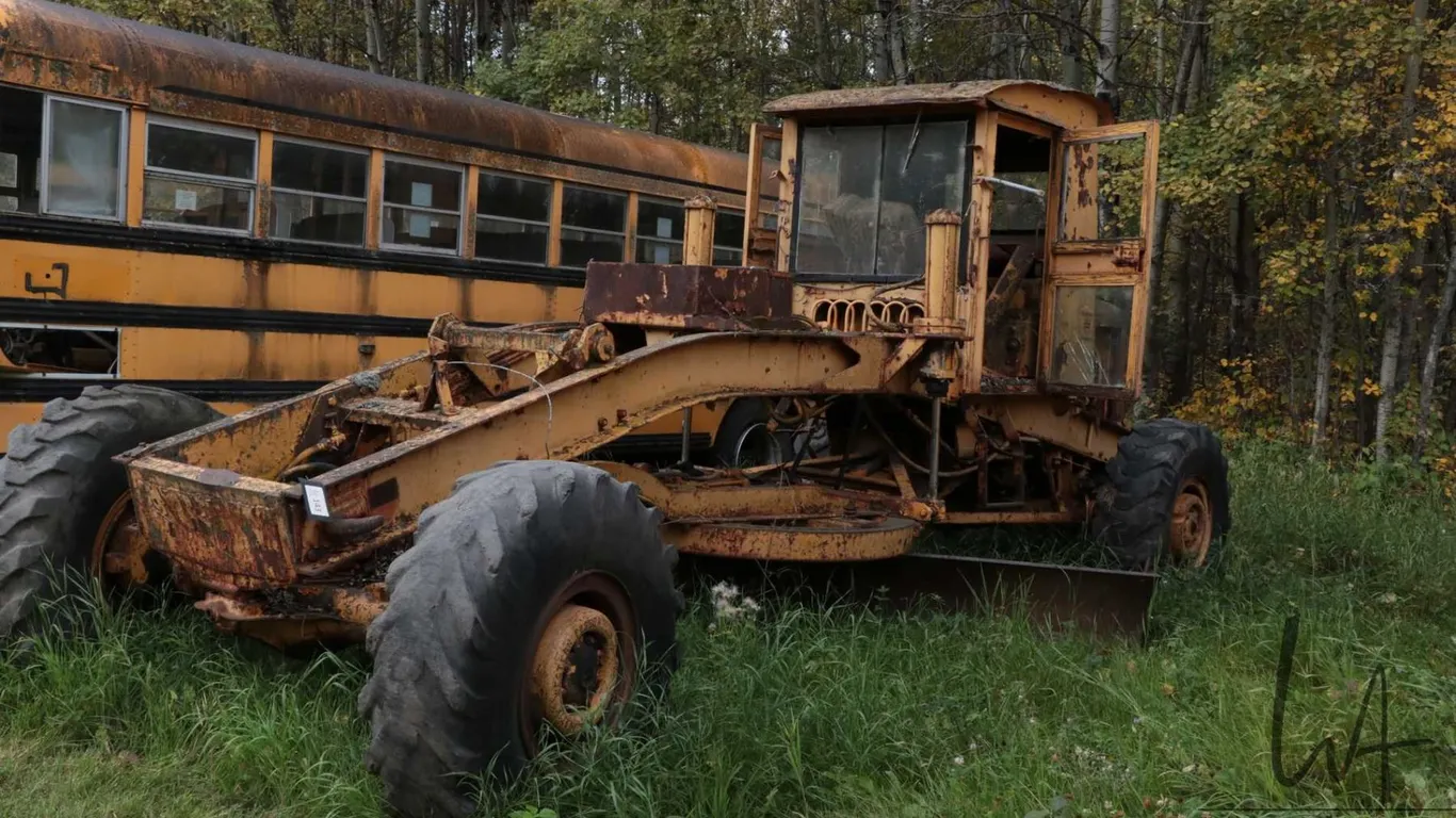 Vintage grader. Not running, but appears mostly complete. Possible project or a construction company