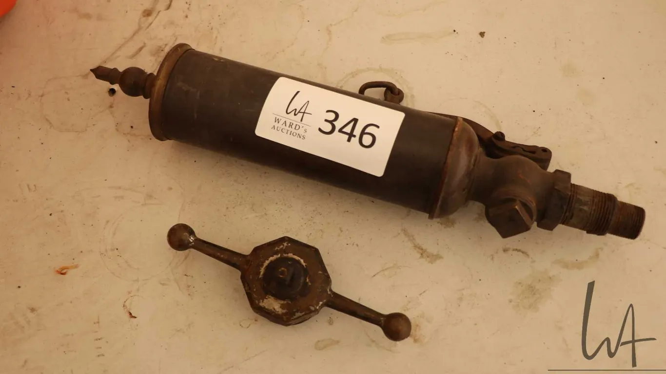 Antique steam whistle and a cap for pressure vessel