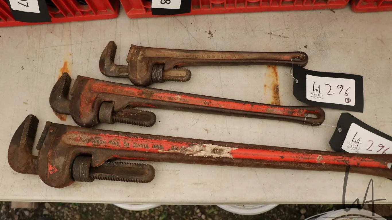 Three graduated sized Ridgid pipe wrenches