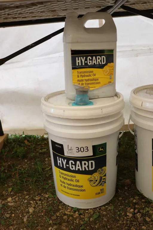 Three quarters filled 18.9 ltr. pail of Hy-Gard hydraulic oil plus a full 3.78 ltr.