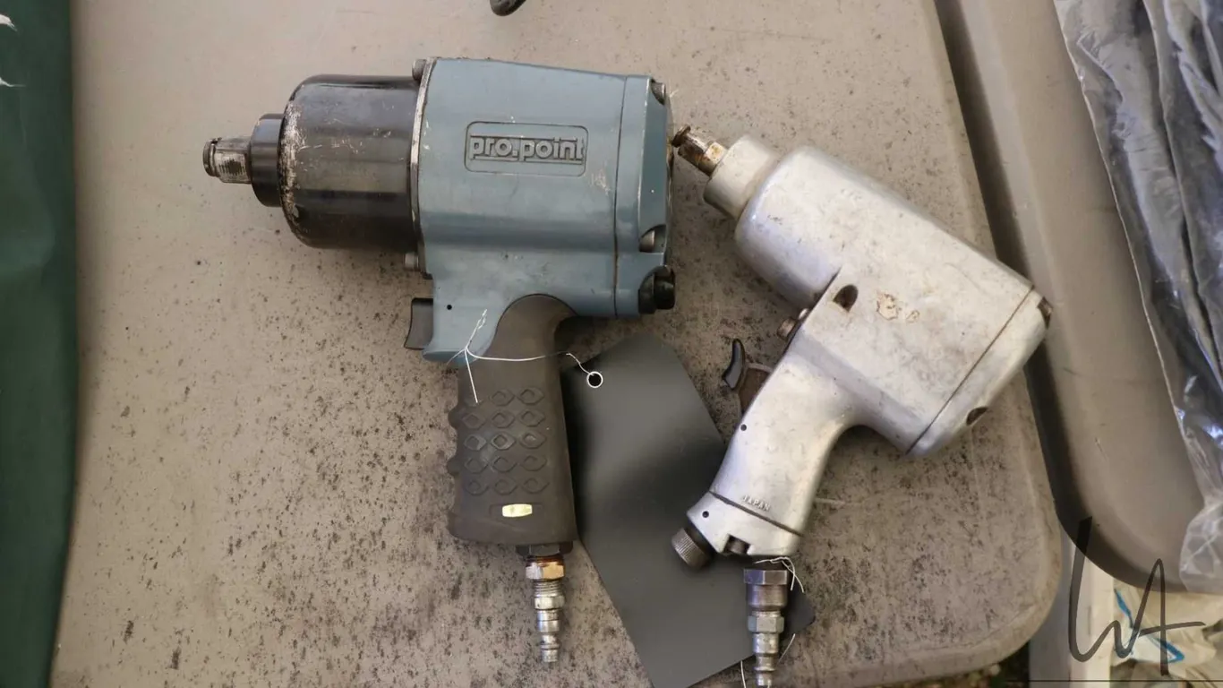 Two pneumatic impact wrenches, one 1/2" and one 3/4"