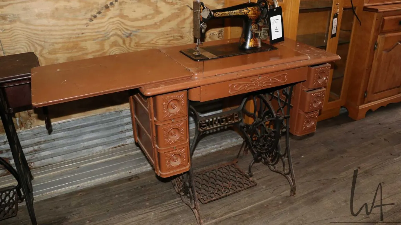 Antique Singer sewing machine in painted cabinet