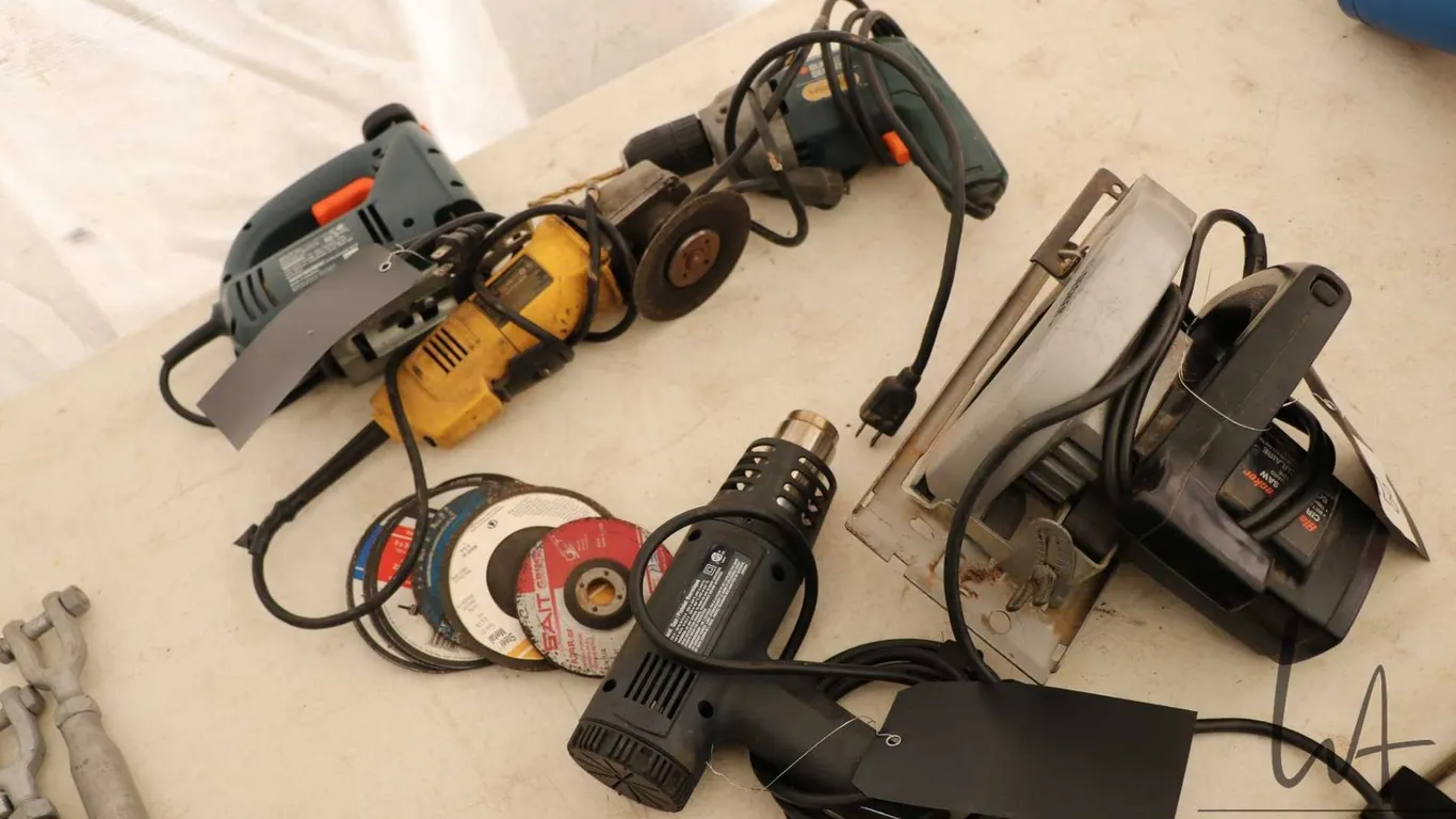 Selection of corded hand tools including circular saw, heat gun, angle grinder etc.