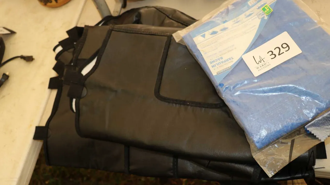 Two winter rad covers for trucks and a small tarp., all appear new