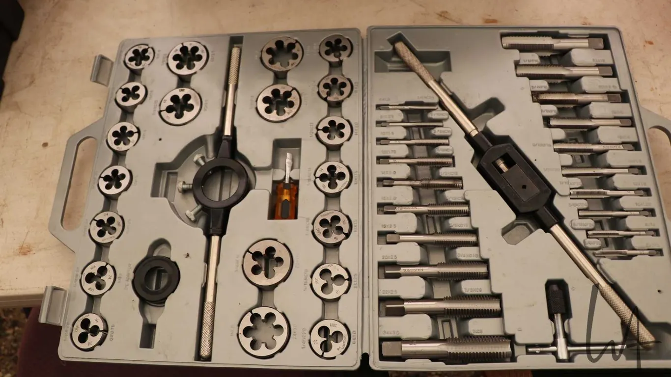 Multi piece tap and die set in plastic case, appears gently used or unused