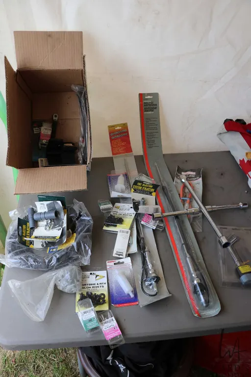 Selection of automotive items including antennas, trim clips, wire loom, battery cables etc.
