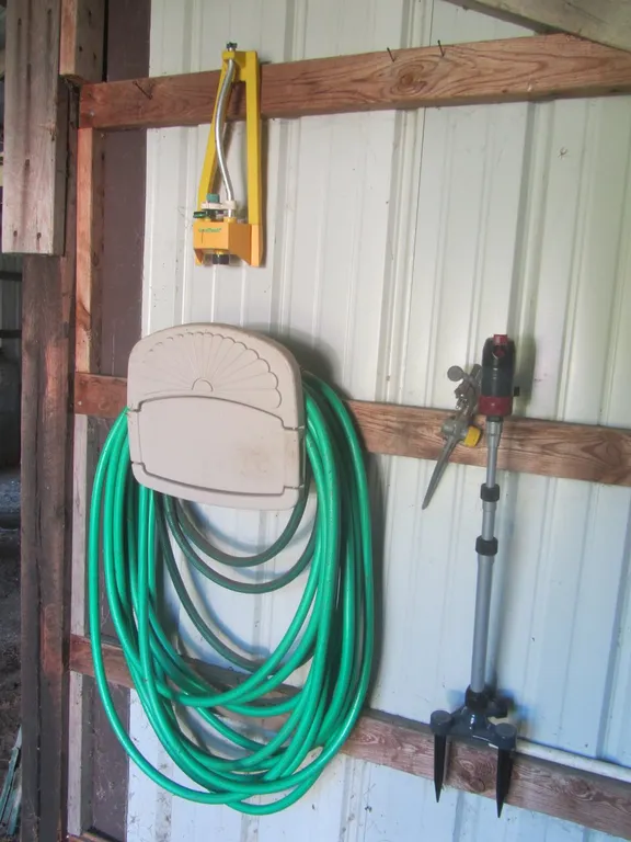 (3) Sprinklers And (2) Garden Hoses