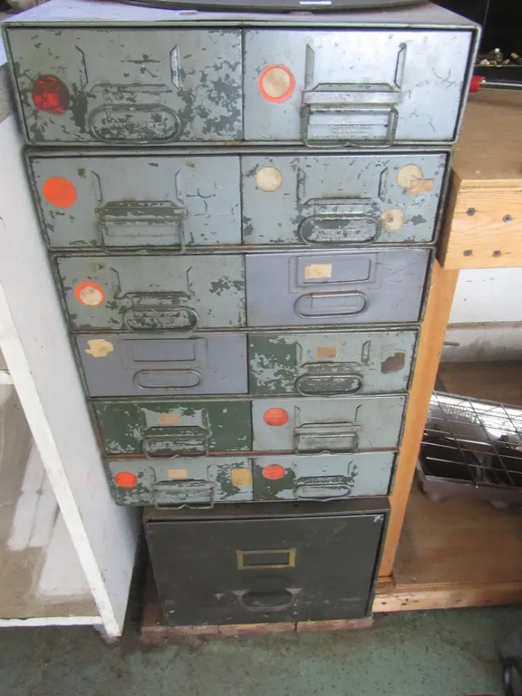 12-Drawer Cabinet And Filing Cabinet Full Of Assorted Hardware