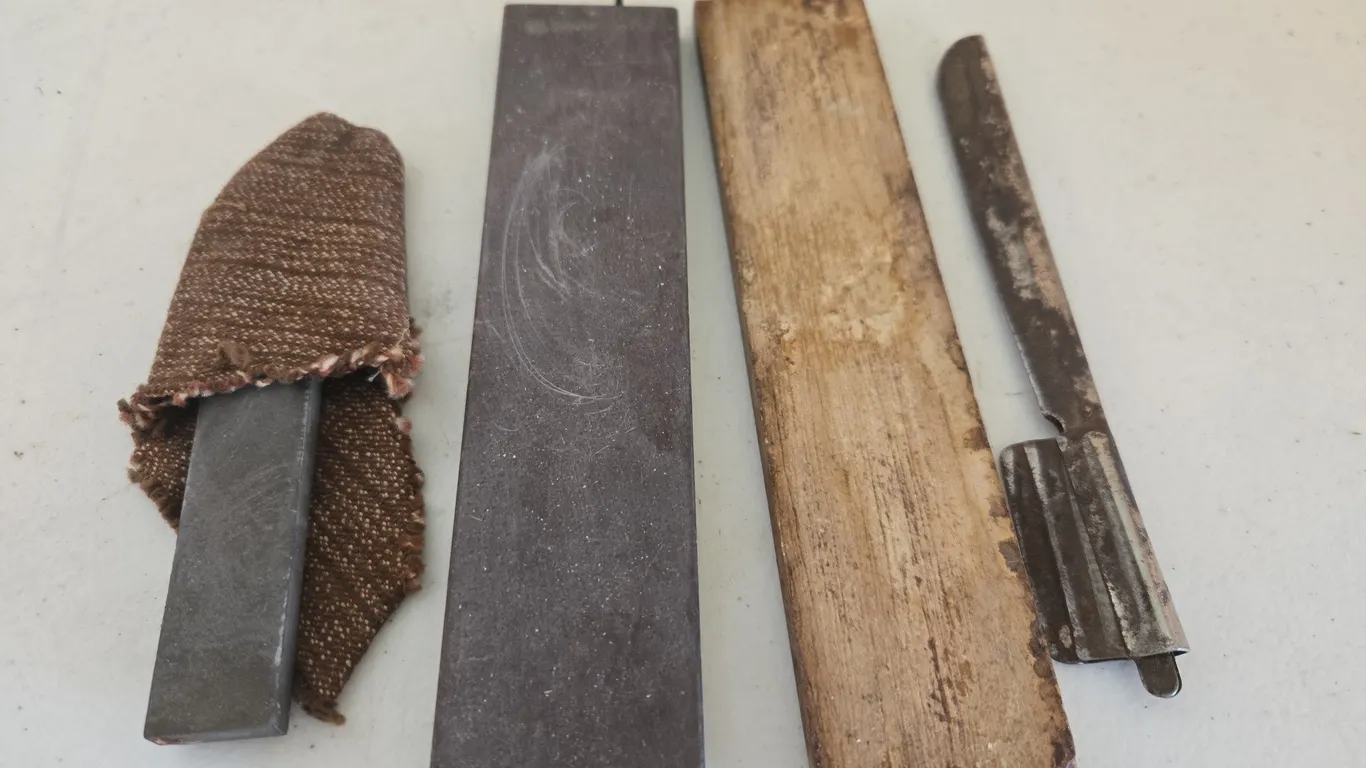 Antique shaving razor blade holder with sharpening stones