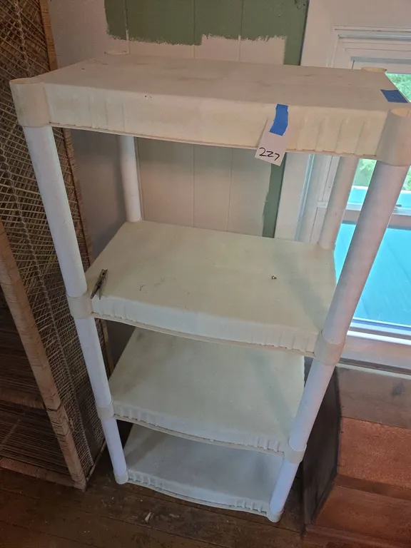 Plastic stack on shelving unit