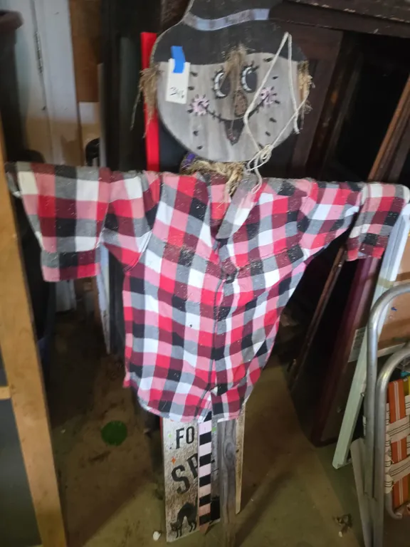 Halloween scarecrow and signs