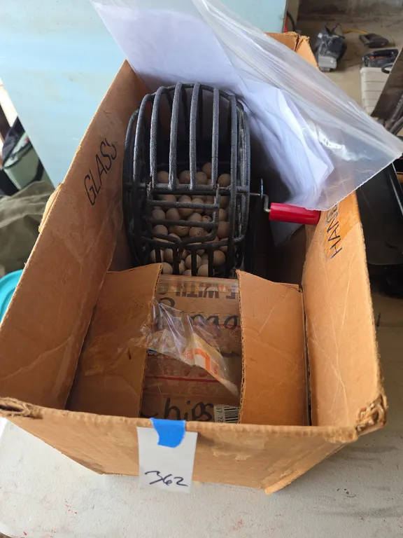 Vintage wire basket spinning bingo game with lettered balls and bingo cards