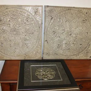 Embossed Metal Wall Panels and Framed Medallion
