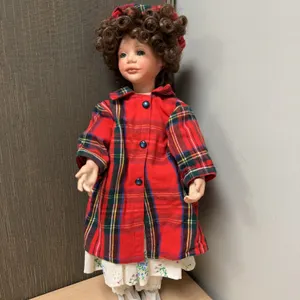 Porcelain Doll with Curly Hair in Red Plaid Outfit