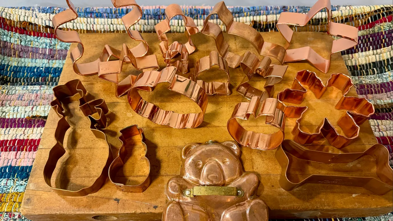 Vintage Cutting Board with Copper Cookie Cutters