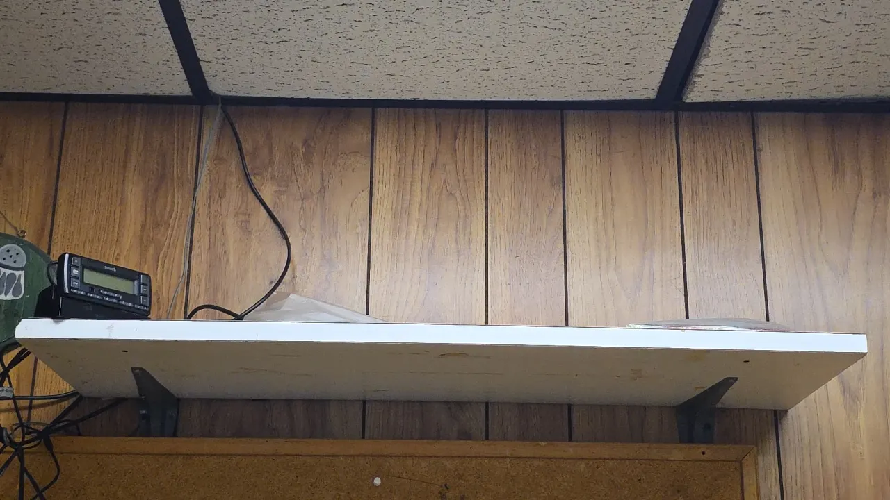 Laminate wood wall shelves. Features metal mounting brackets. Includes Sirius satellite radio receiver with dock. Dimensions: 36" to 48"L.