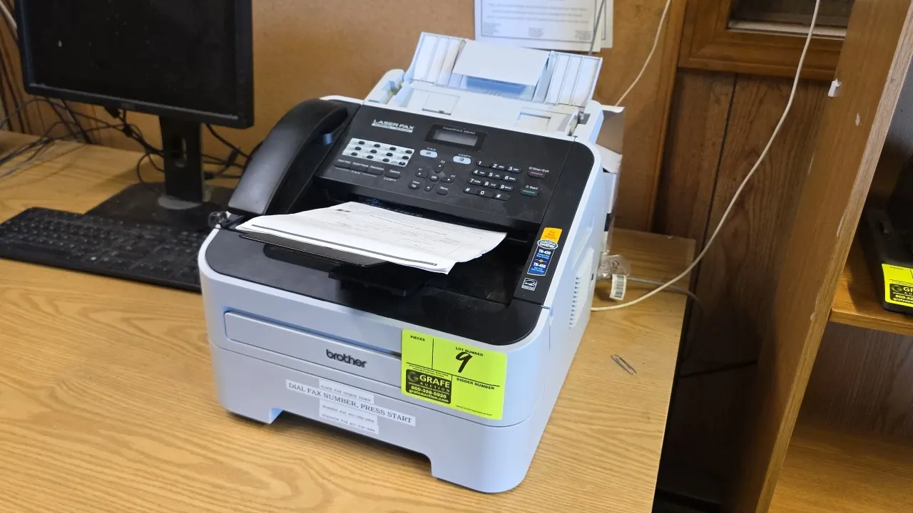 2022 Brother FAX-2840 laser fax, copier, and printer machine. Features integrated telephone handset, LCD display control panel, automatic document fee