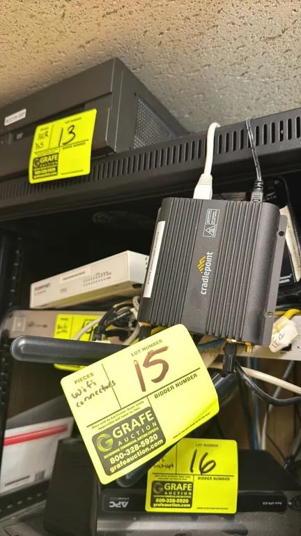 Cradlepoint IBR650C-150M-D router (Model: S5A907A). Features compact metal housing with integrated mounting tabs and external paddle antennas. S/N: WA