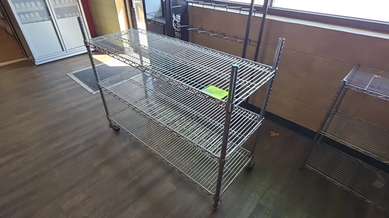 Three-tier wire shelving racks. Features chrome-plated wire construction with three adjustable shelves. Dimensions: 48"L x 18"W x 36" to 40"H. One uni